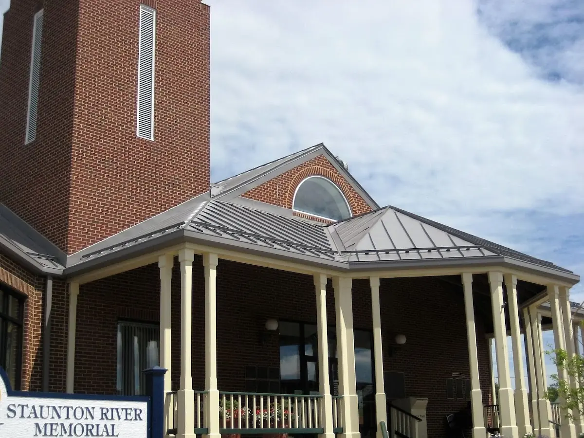 Skilled roofing craftsmen working on a residential roof in Bloom Center